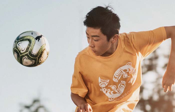 Youth playing soccer